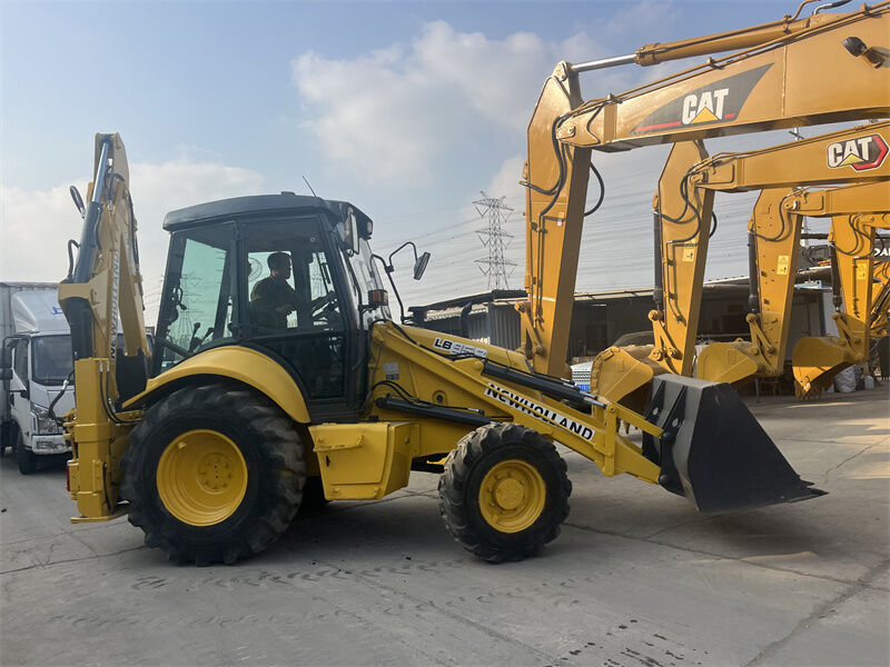 Used New Holland LB95B-4PT Backhoe Loader with 4-in-1 Multipurpose Bucket, Pilot Controls, and ROPS/FOPS Enclosed Cab