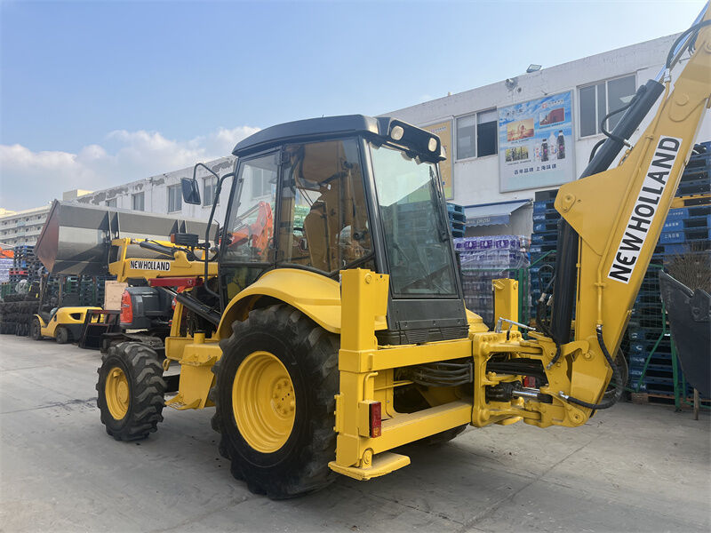 Used New Holland LB95B-4PT Backhoe Loader with 4-in-1 Multipurpose Bucket, Pilot Controls, and ROPS/FOPS Enclosed Cab